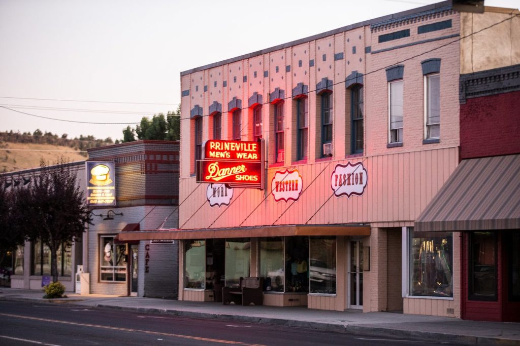 prineville Signs for Prineville Men's Wear and Dad's Place light up the streets of downtown Prineville, Oregon.