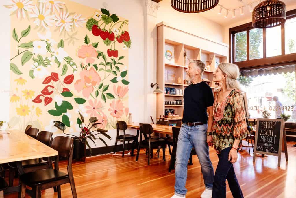 2021-06-24-VCO-Redmond-185-large Two people admire a mural inside of the SCP Redmond Hotel in Central Oregon
