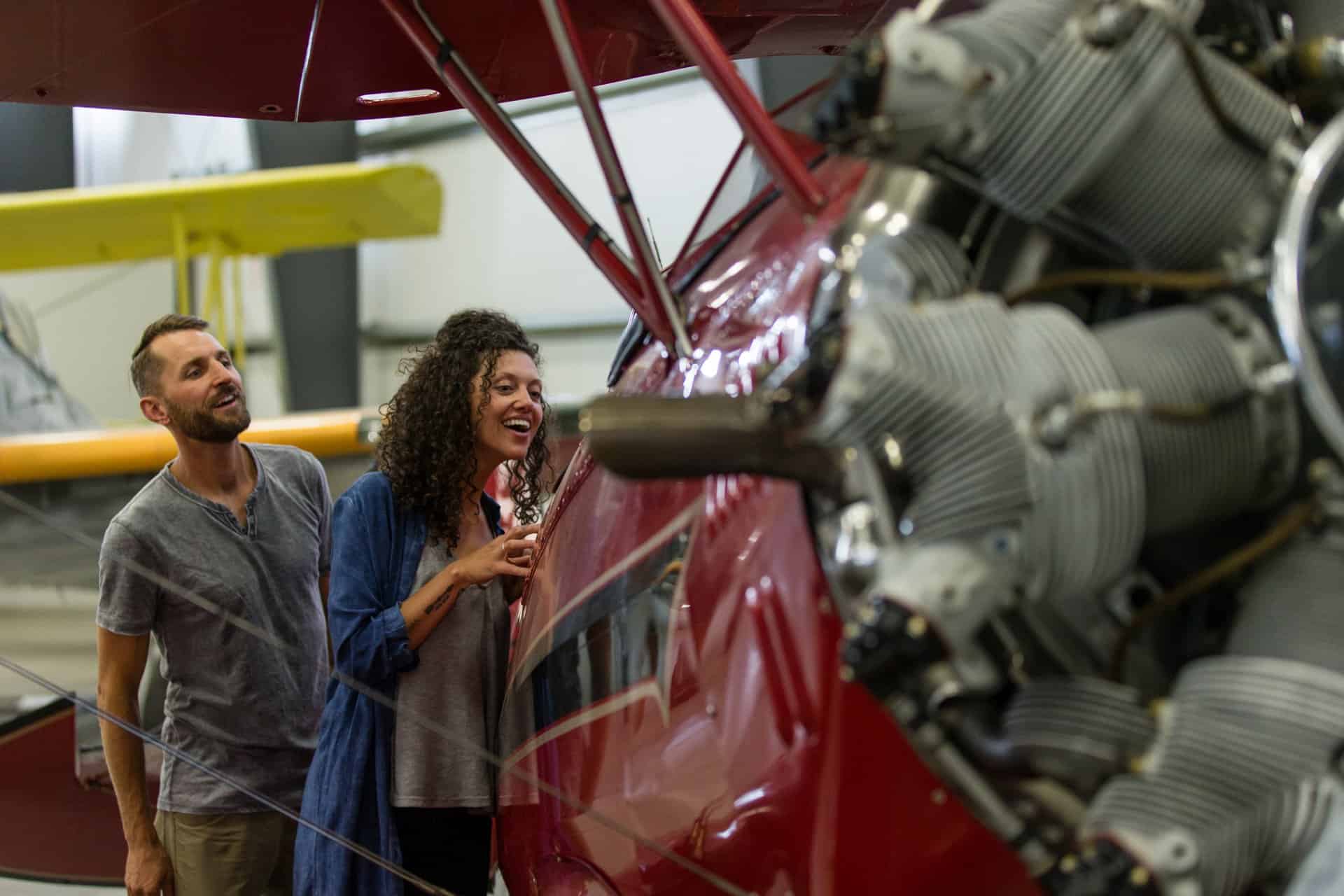 outdoor-adventure travel photography by steve heinrichs_-26-large Couple looks into vintage aircraft at the Erickson Aircraft Collection museum in Madras, Oregon
