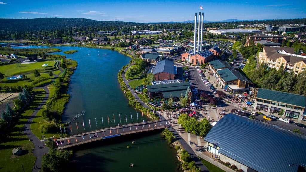 Old-Mill-large ariel view of the 3 old smokestacks, park with a river running between.