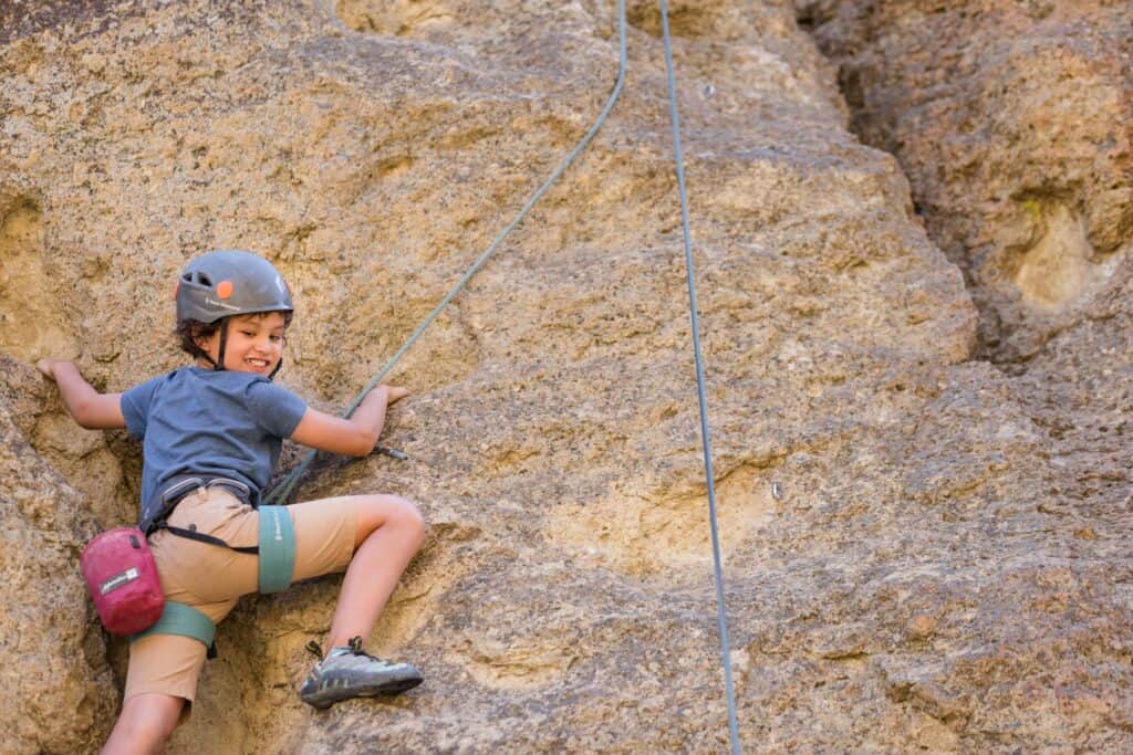 outdoor-adventure travel photography by steve heinrichs_-32-large Young boy rock climbs at Smith Rock State Park in Terrebonne, Oregon