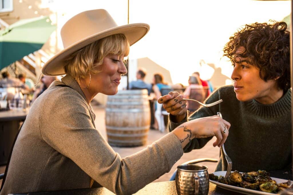 steve heinrichs photography-167-large Two women eating outside at the Sisters Saloon in Sisters, Oregon