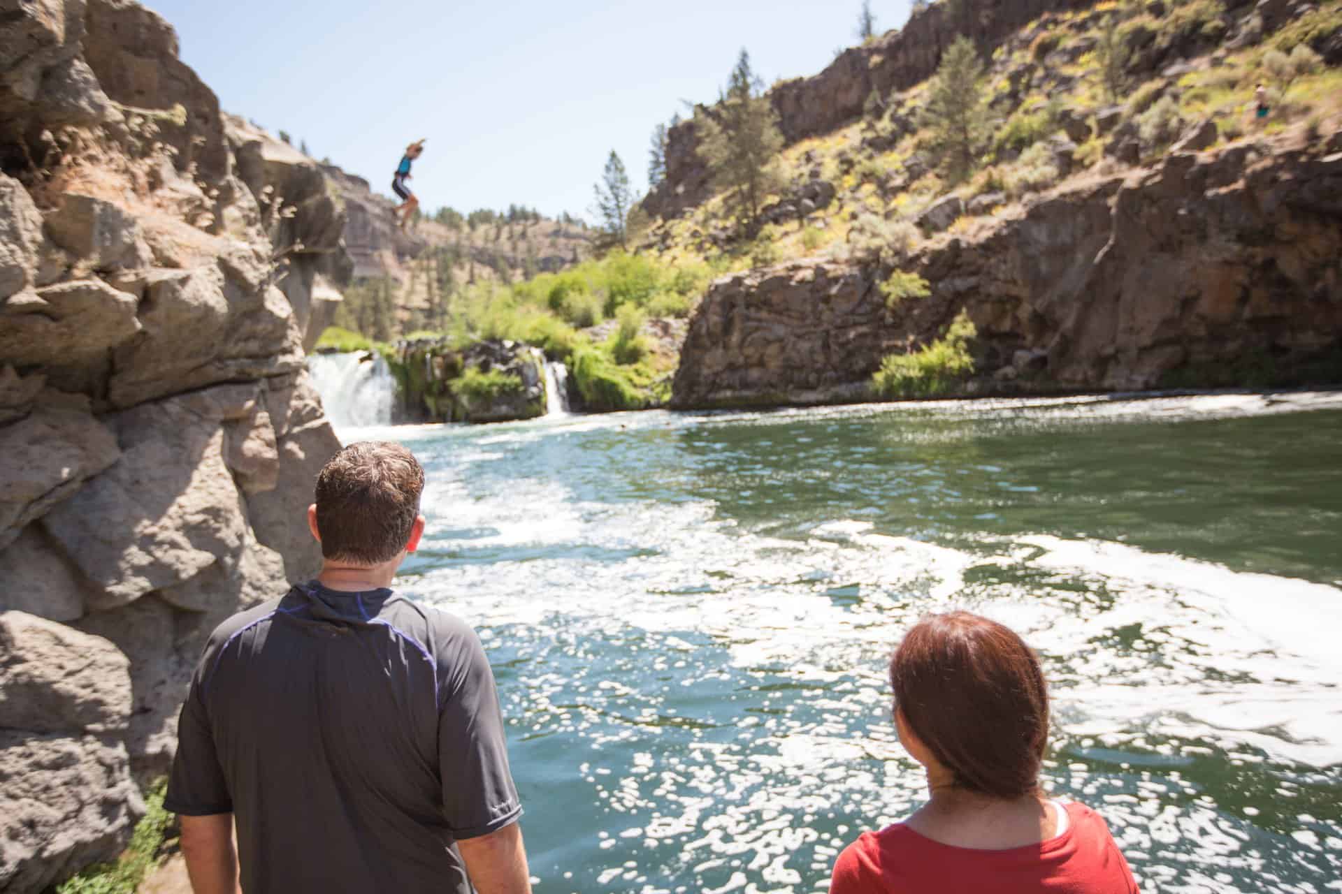 outdoor-adventure travel photography by steve heinrichs_-14-large Two people watch a kid jump into the water at Steelhead Falls