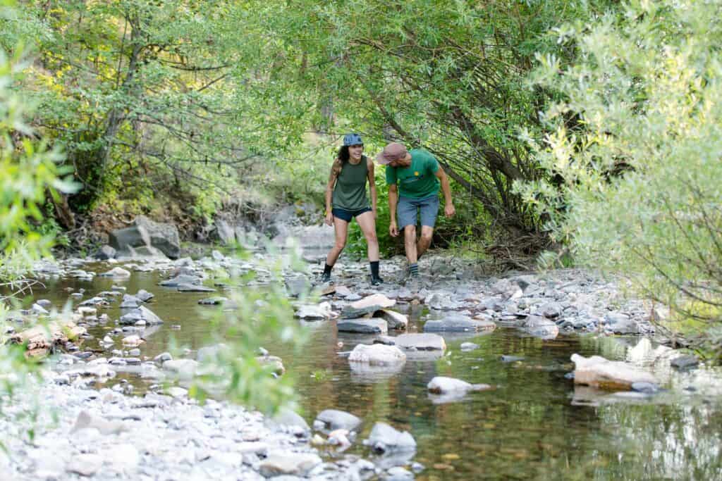 outdoor-adventure travel photography by steve heinrichs_-7-large Couple walks underneath shrubs along creek near Prineville, Oregon