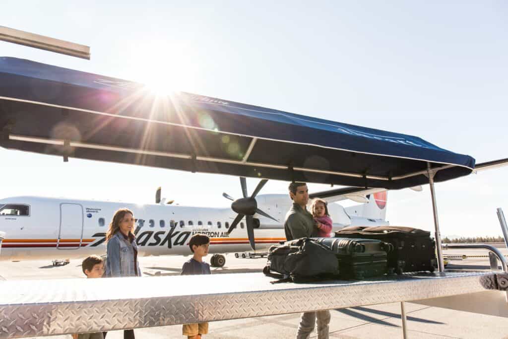 steve heinrichs photography-4-large Family of five picks up their bags on the tarmac at the Redmond Airport