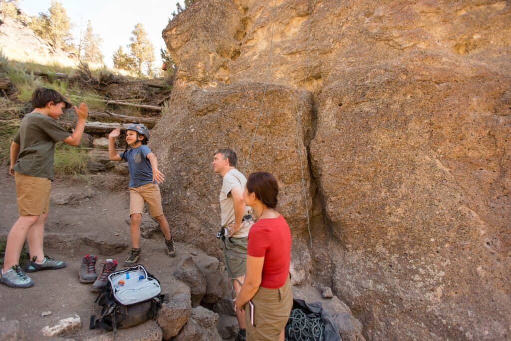 Family of four at Smith Rock State Park rock in Terrebonne, Oregon rock climbing