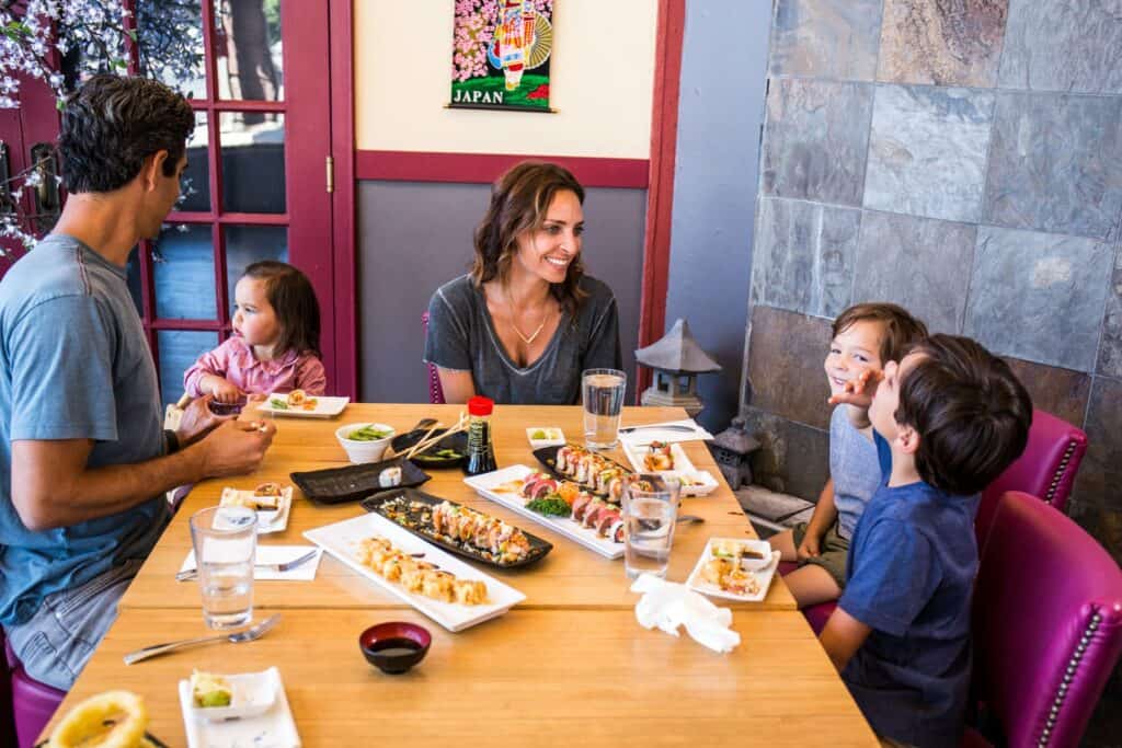 Family of five eats sushi at Oishi Sushi in Redmond, Oregon