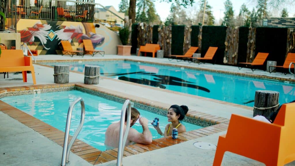 C0445-large Two people sit in a hot tub at Campfire Hotel in Central Oregon