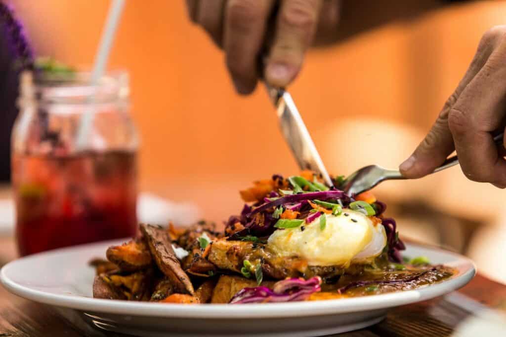 steve heinrichs photography-55-large Eggs benedict and a drink outside at Chow restaurant in Bend, Oregon