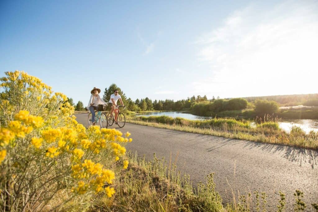outdoor-adventure travel photography by steve heinrichs_-83-large Couple bikes on paved path by the river in Sunriver, Oregon