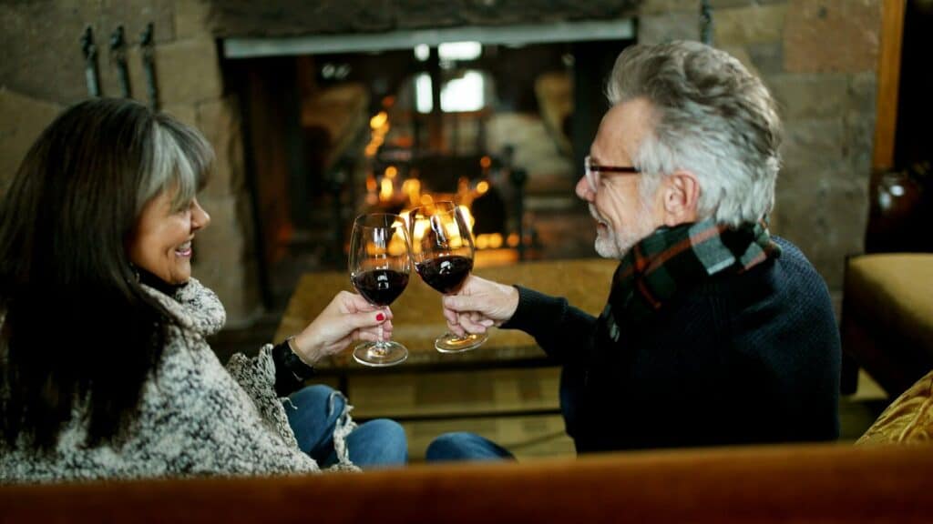 All_Footage-large Couple in their 60s drinking red wine at Tetherow Resort in Bend, Oregon
