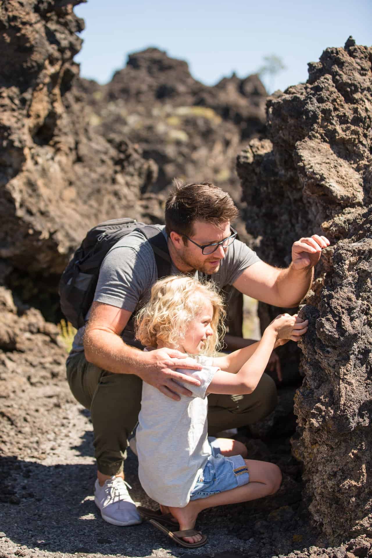 outdoor-adventure travel photography by steve heinrichs_-26-large Father and son look at lava rock at Lava Lands near Bend, Oregon