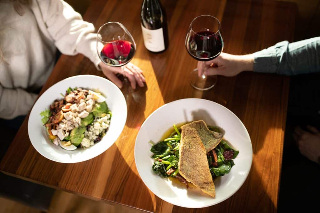 SRR_WinterLifestyle_03.22.21_TylerRoemer_ARR-087_HiRes (1) a table for two, two glasses of wine and two nicely plated meals