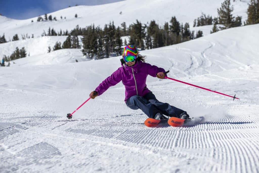 _10T3945 (1) a woman skiing corduroy on a bluebird day at Mt Bachelor
