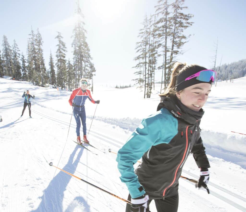Bachelor20210228_BB_5739 (2) three people skate skiing on groomed trails at Mt Bachelor Resort