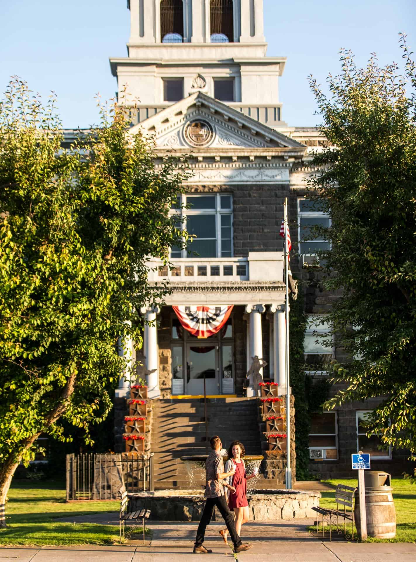 outdoor-adventure travel photography by steve heinrichs_-14-large (1) A man and woman walk in front of the historic courthouse in Prineville, Oregon.