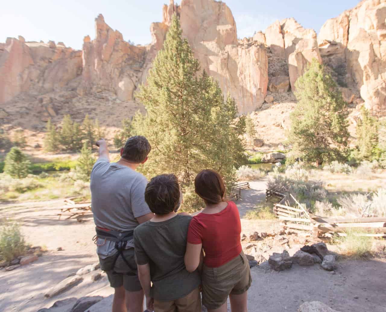 outdoor-adventure travel photography by steve heinrichs_-41-medium Family of three in climbing gear looks at Smith Rock in Terrebonne, Oregon