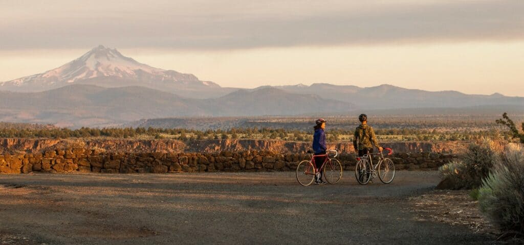 bbb-outdoor-adventure travel photography by steve heinrichs_-14-large (1) A man and a woman with cycling bikes look out at Lake Billy Chinook near Madras, Oregon.