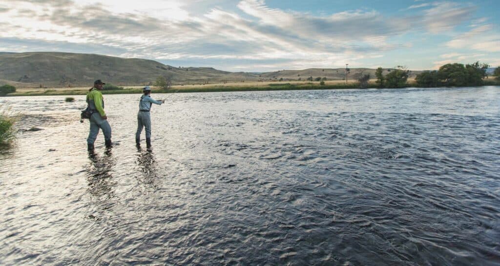 outdoor-adventure lifestyle photography by steve heinrichs_-11-large (1) Man and woman fly fish on the banks of the river in Warm Springs, Oregon.