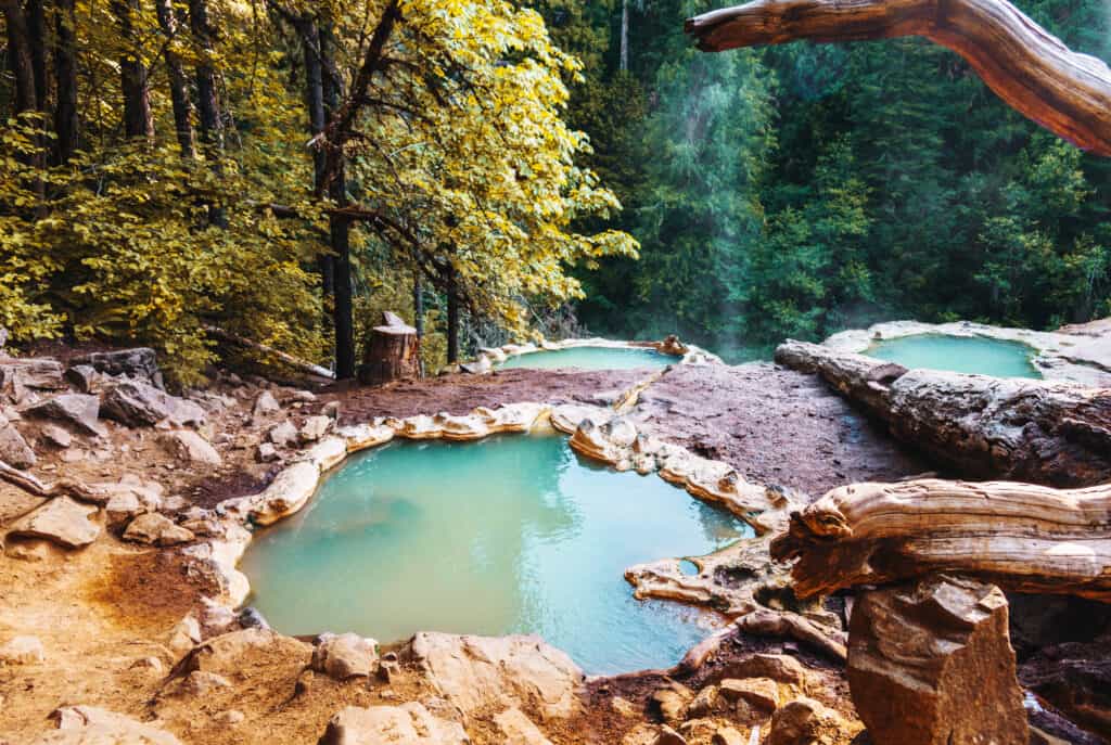 man resting in an hot spring in oregon a man resting is hot springs