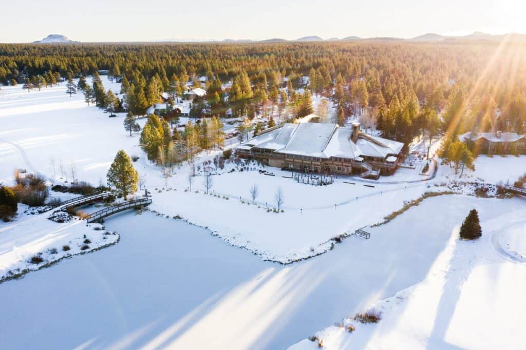 Tyler-Roemer_Sunriver_2021_Winter_lores-009-medium aeriel of Sunriver resort surrounding by pines and snow