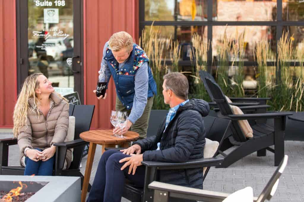 steve heinrichs photography-154-large 5 people sitting around an outdoor bar table drinking beer